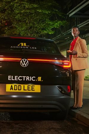 500x700_03-Addison-Lee-iD4-electric-Car-with-woman-in-suit